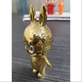 Labubu The Monsters Mini Labubu Goud HOW2WORK 20th Anniversary LIMITED